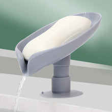 Self-draining leaf-shaped soap dish for kitchen or bathroom use.