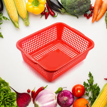 Kitchen organizer basket made of plastic, designed for washing vegetables and fruits.