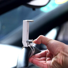 Secure mobile holder attached to steering wheel