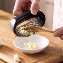 Garlic press on table